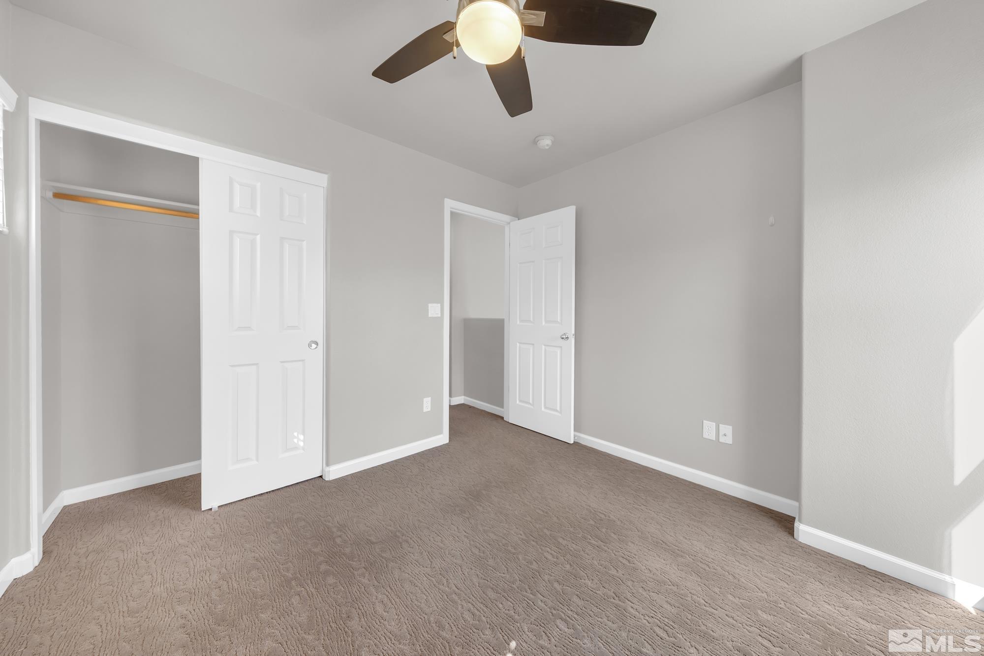 9266 Running Dog Circle Reno, NV 89506 - Photo 17 of 35 a view of an empty room and chandelier fan