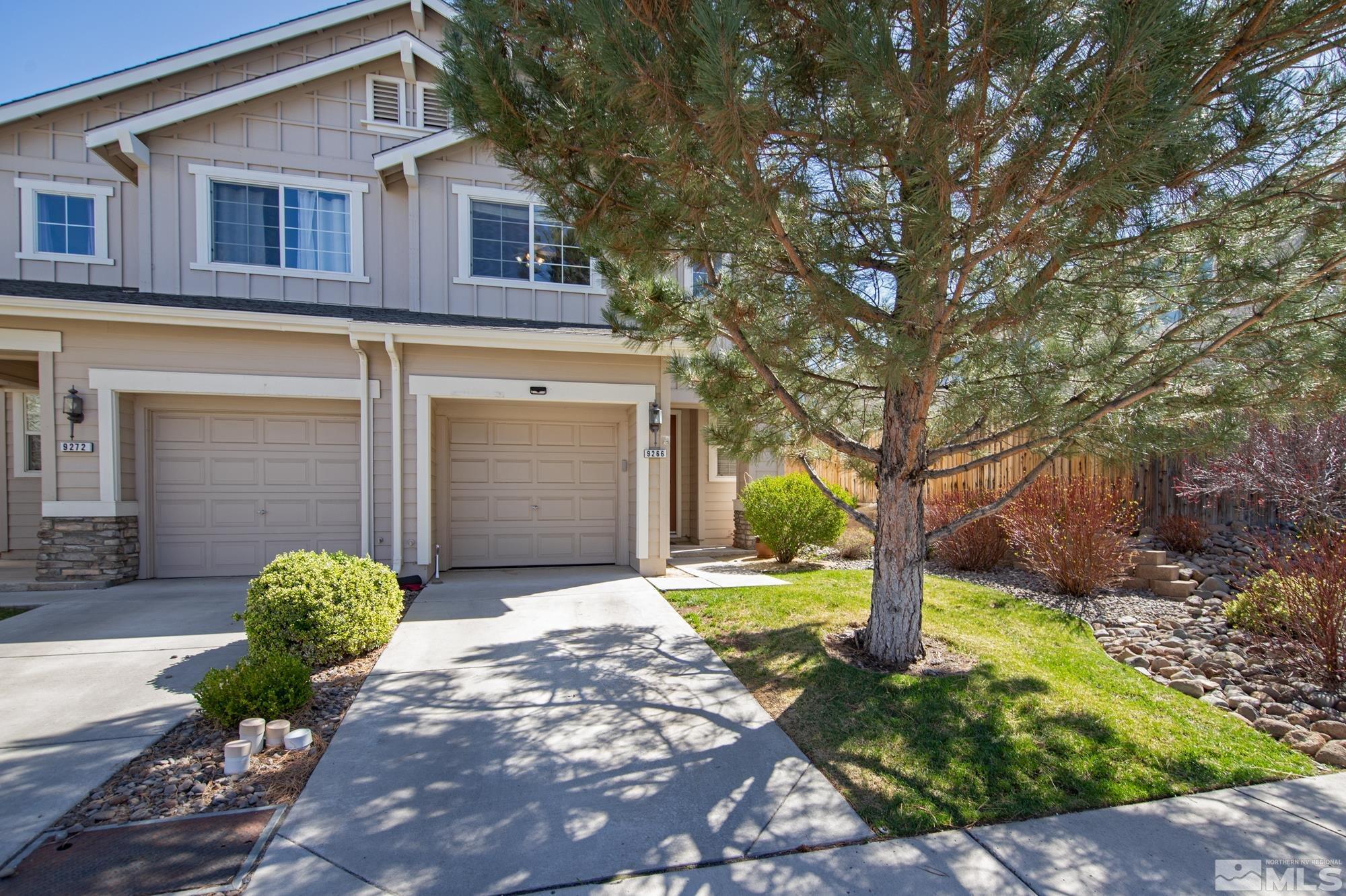 9266 Running Dog Circle Reno, NV 89506 - Photo 2 of 35 a front view of a house with garden