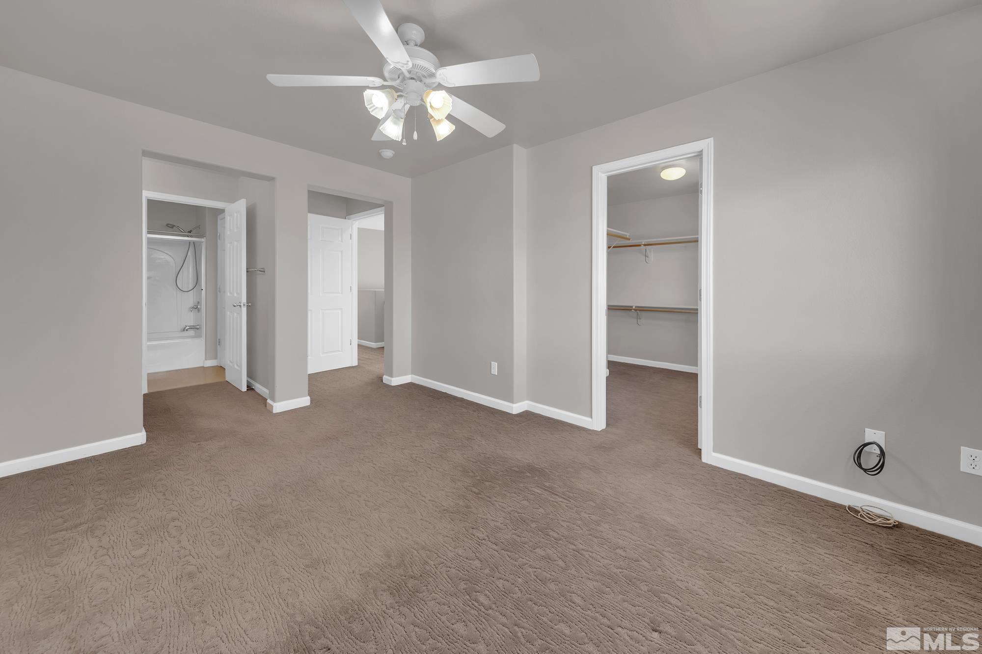 9266 Running Dog Circle Reno, NV 89506 - Photo 24 of 35 an empty room with closet and fan