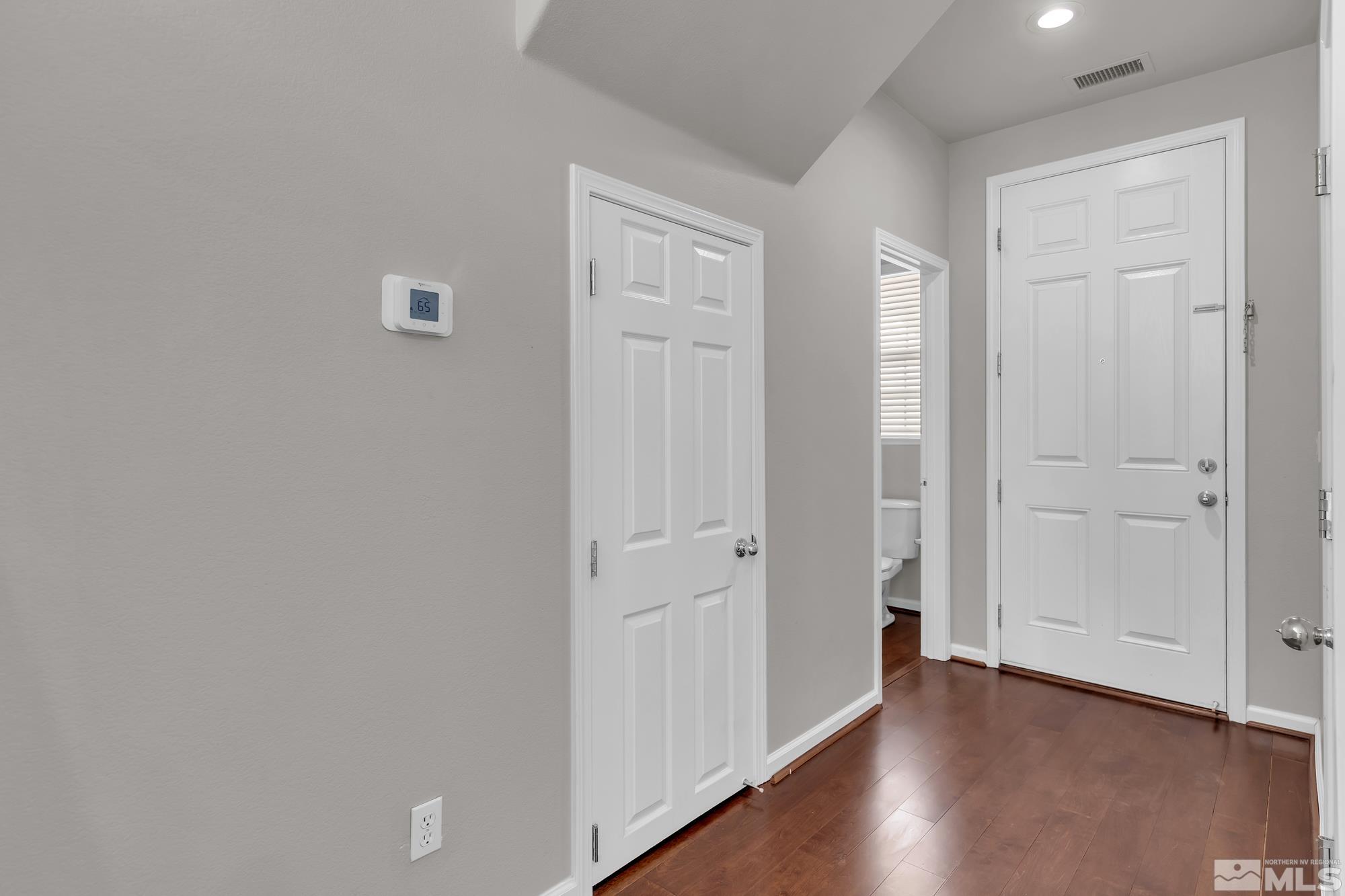 9266 Running Dog Circle Reno, NV 89506 - Photo 4 of 35 a view of a hallway with wooden floor