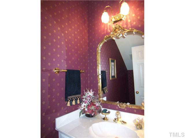9101 Kettner Court Raleigh, NC 27615 - Photo 13 of 25 Nearby is the pretty Half Bath, door to the oversized 2-car Garage and the back stairs to the Bonus Rm. Half Bath