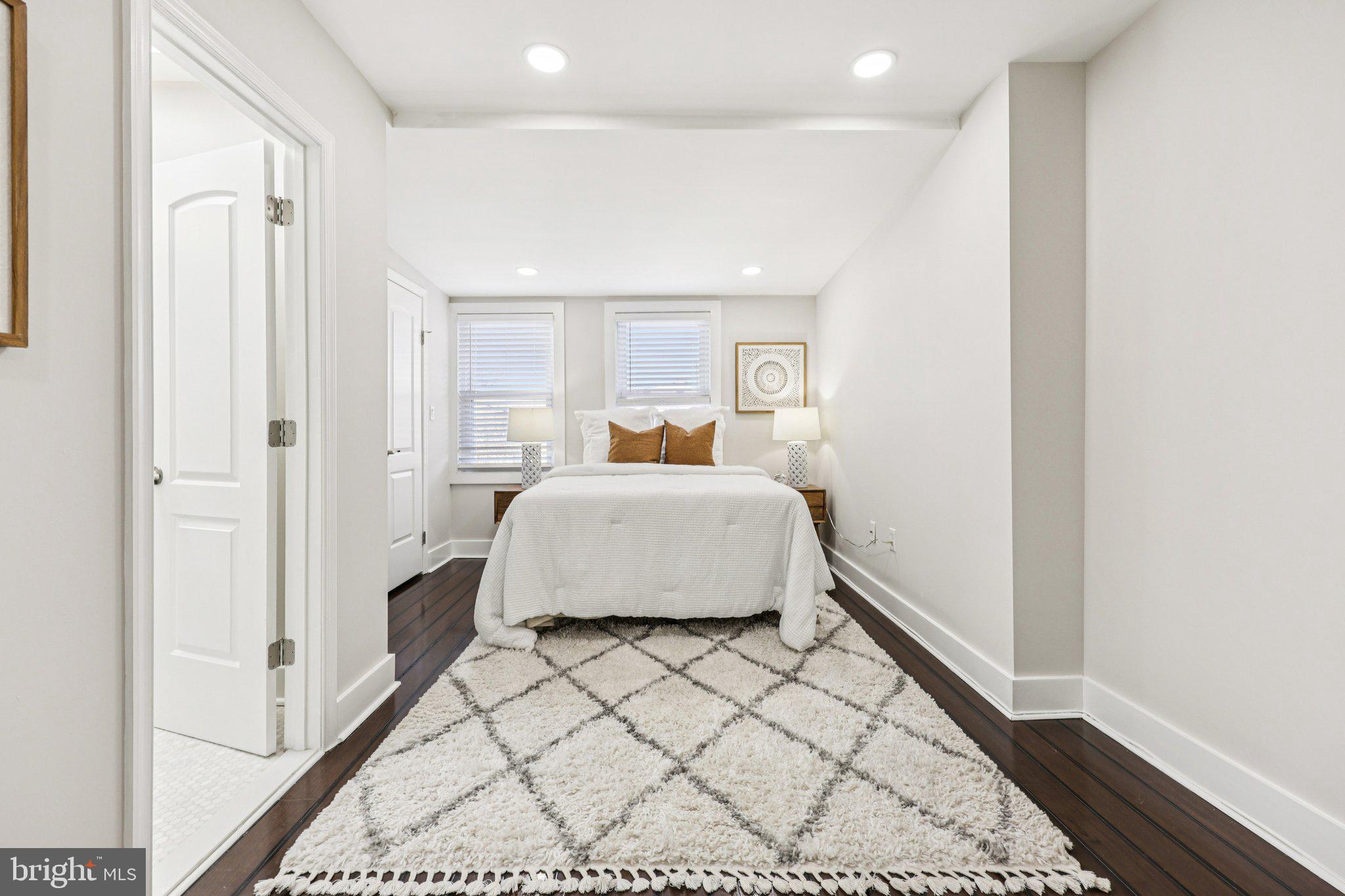 5209 5th Street Northwest Washington, DC 20011 - Photo 11 of 38 a bedroom with a bed and a window