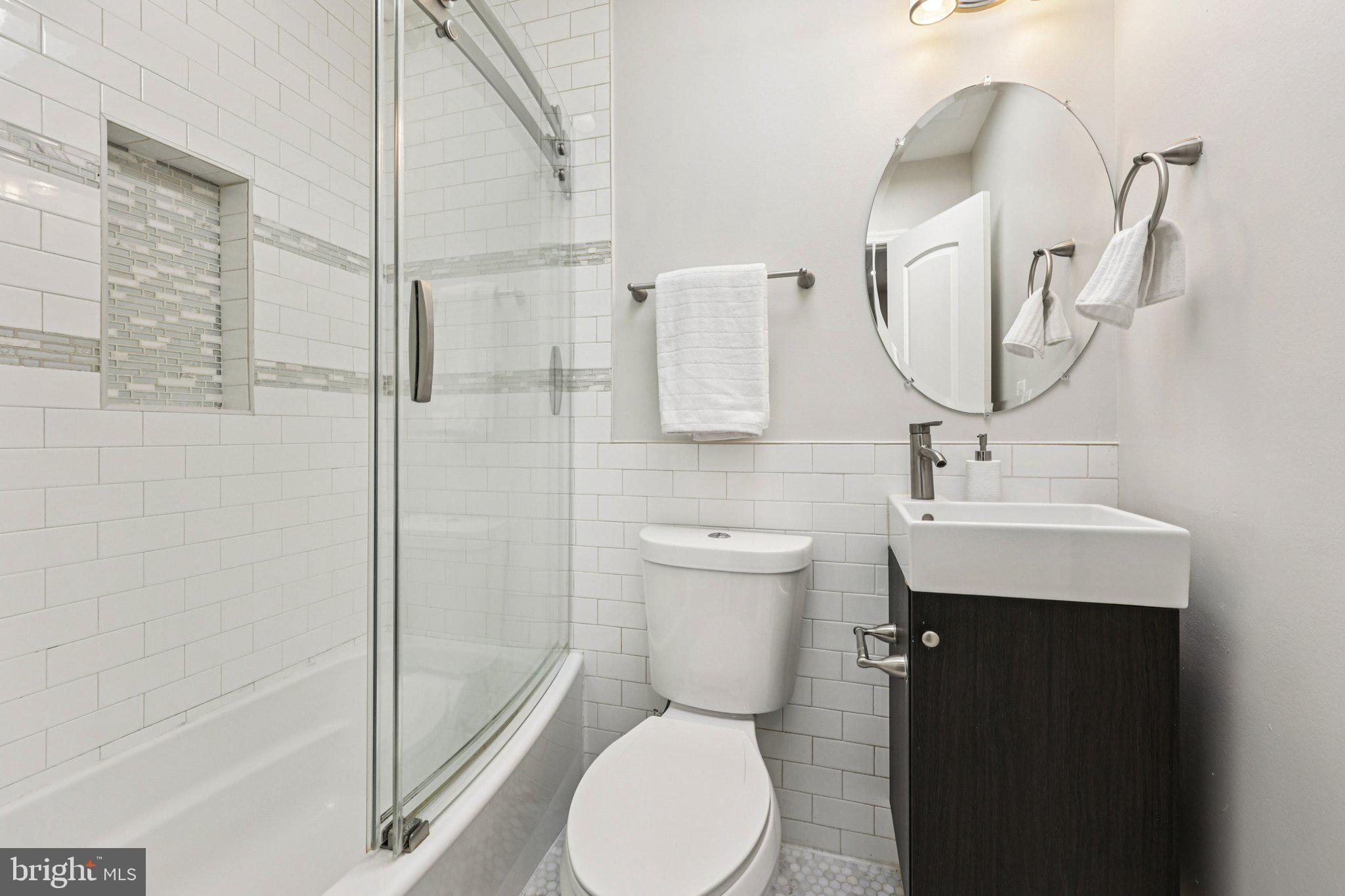 5209 5th Street Northwest Washington, DC 20011 - Photo 14 of 38 a bathroom with a sink toilet and shower