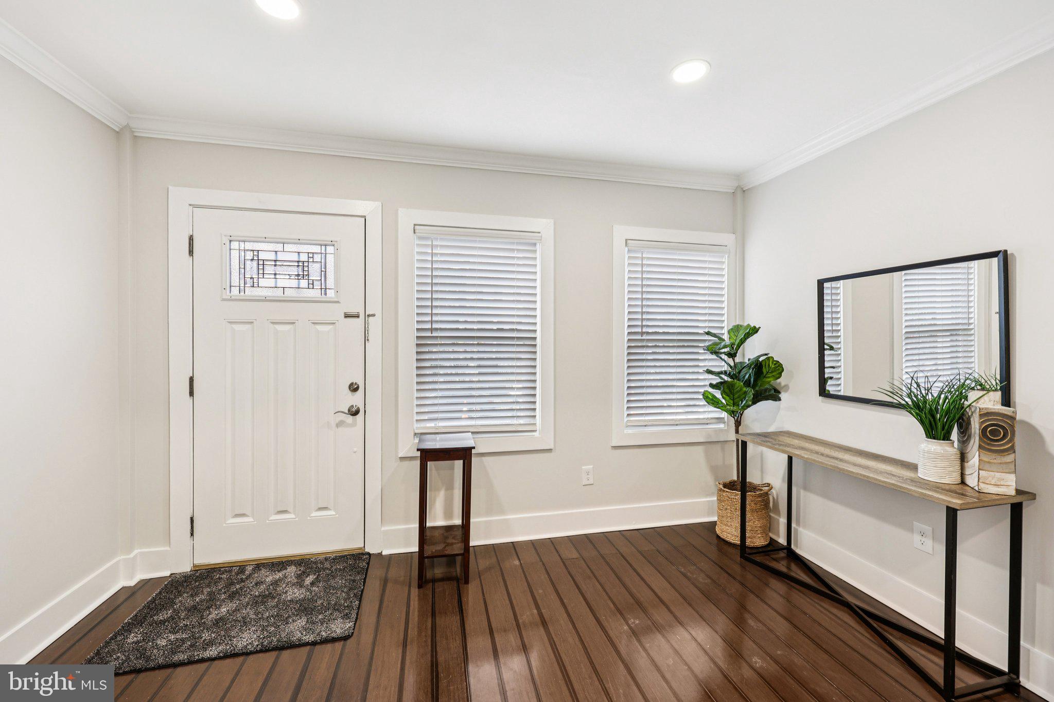 5209 5th Street Northwest Washington, DC 20011 - Photo 2 of 38 a living room with wooden floor and potted plant