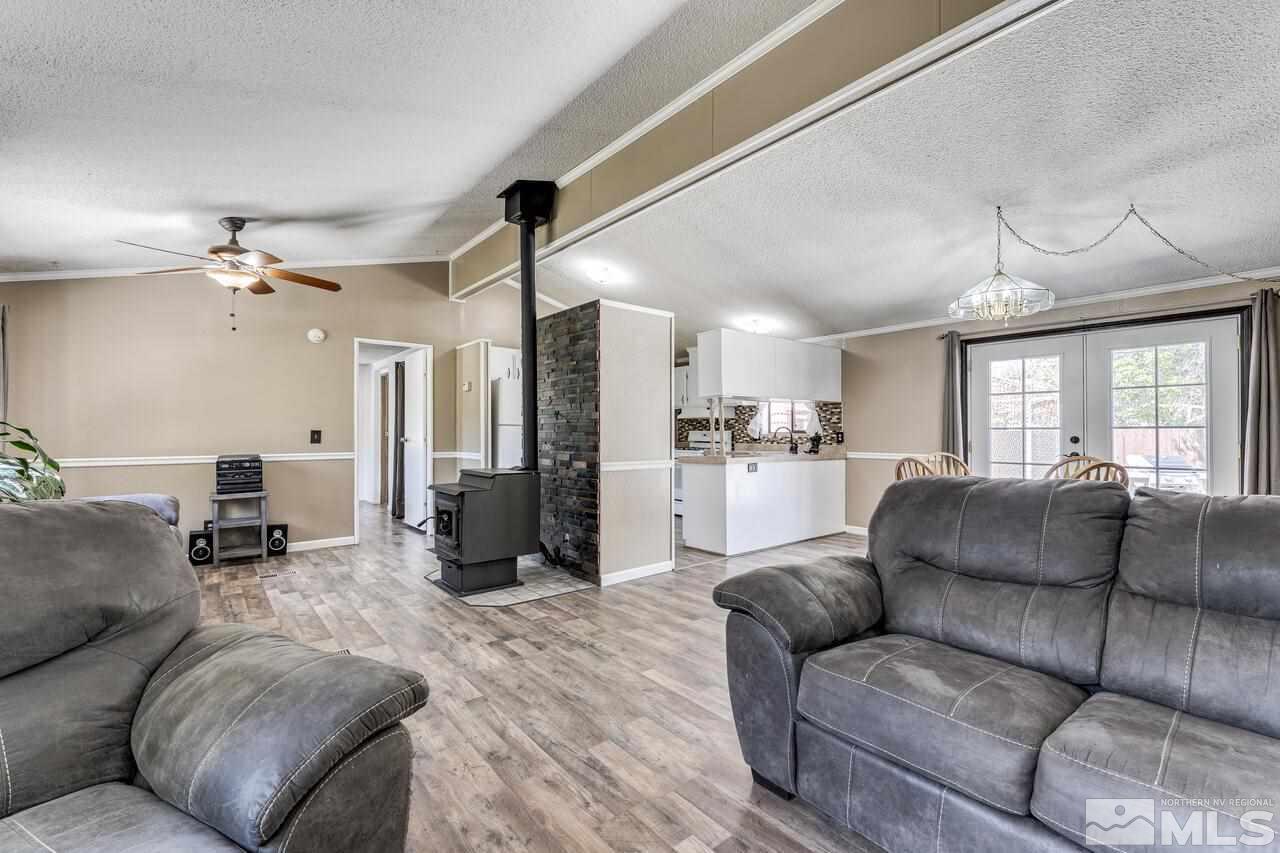 17625 Macaw Lane Reno, NV 89508 - Photo 11 of 40 a living room with furniture and a chandelier