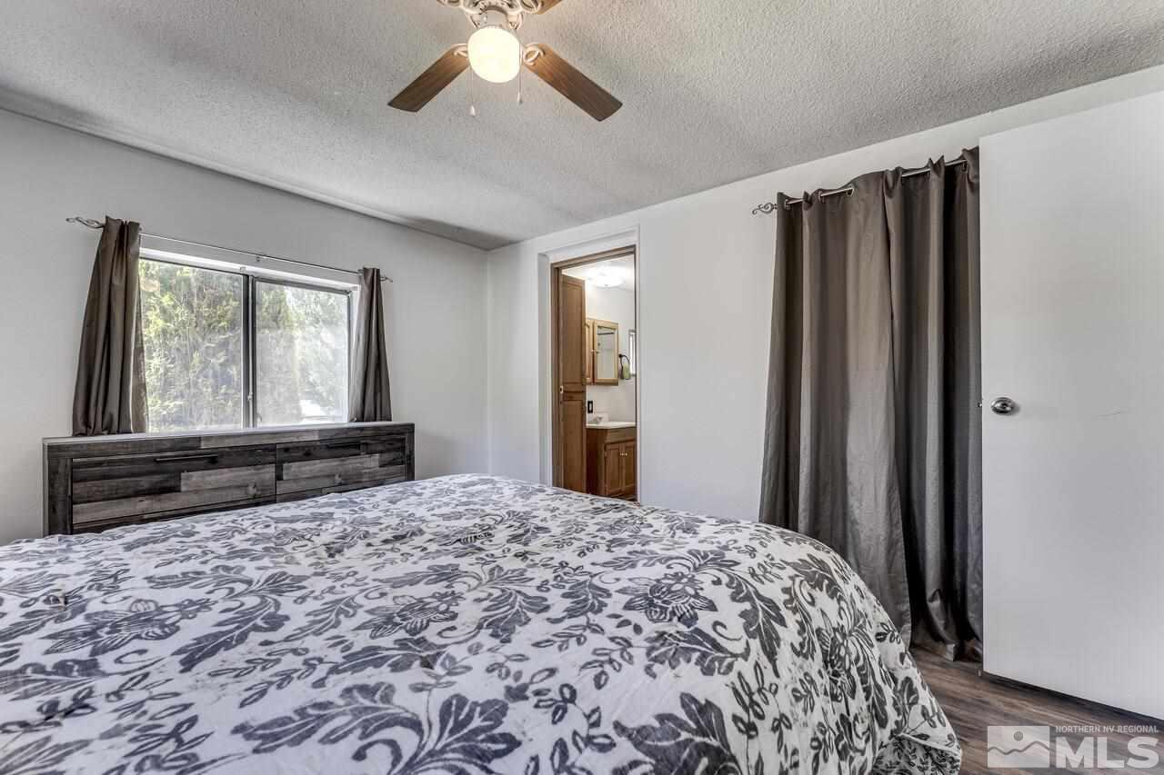 17625 Macaw Lane Reno, NV 89508 - Photo 29 of 40 a bedroom with a bed and a large window