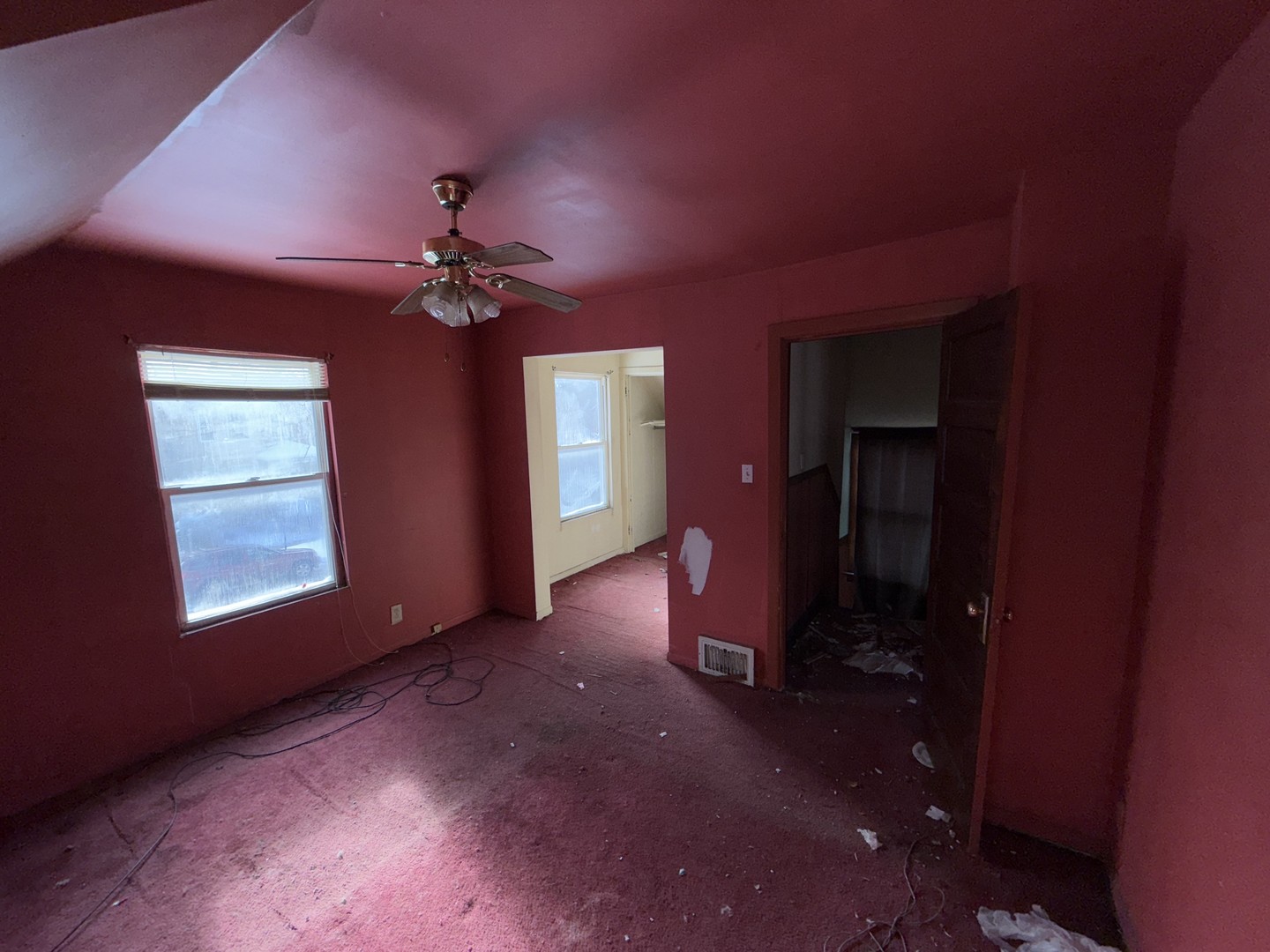 4940 West Superior Street Chicago, IL 60644 - Photo 6 of 7 a view of a livingroom with a ceiling fan and window