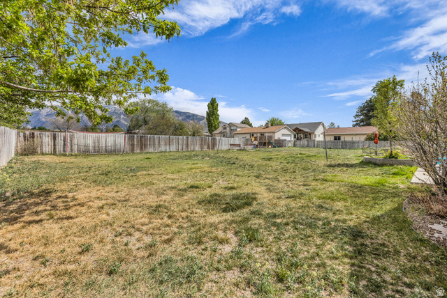 10705 Green Ridge Drive Sandy, UT 84070 - Photo 46 of 55 Fenced backyard with a mountain view