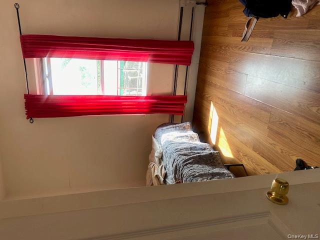 91-07 139th Street Queens, NY 11435 - Photo 6 of 12 a view of a room with wooden floor and windows