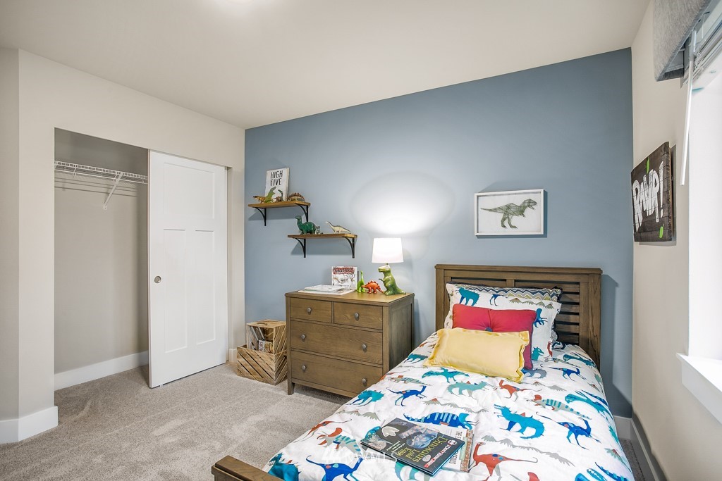 3908 242nd Street Southeast, Unit PT 2 Bothell, WA 98021 - Photo 21 of 28 a bedroom with a bed and dresser