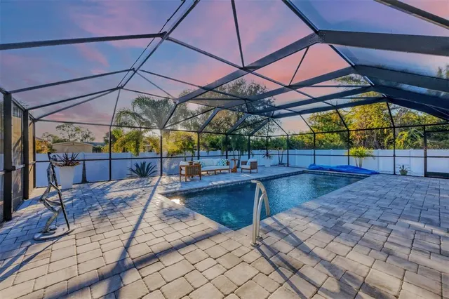 a view of a backyard with sitting area