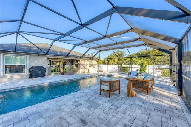 a view of patio with swimming pool