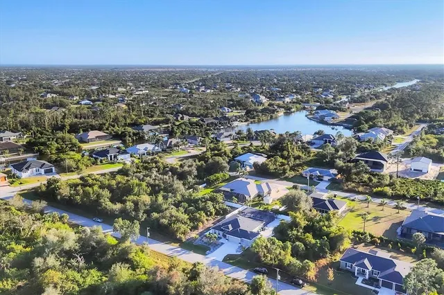 an aerial view of residential building and trees around