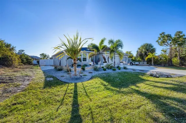 a view of a fountain in the backyard of a house