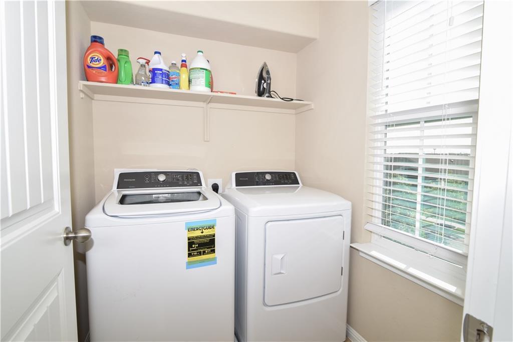 18405 Congaree Street Pflugerville, TX 78660 - Photo 11 of 26 a utility room with dryer and washer