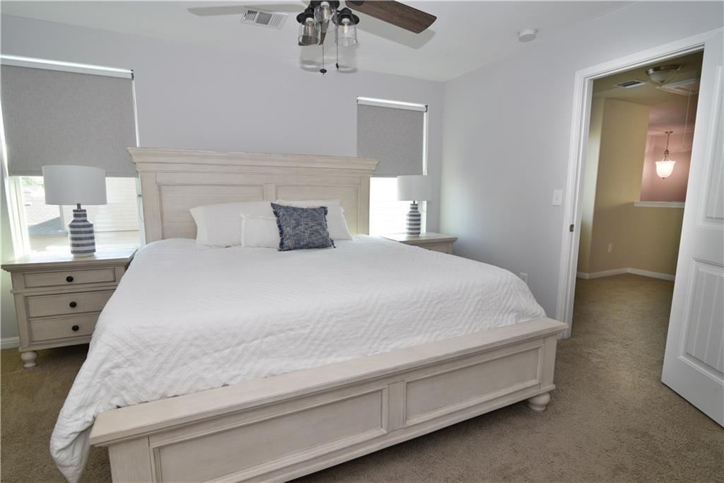 18405 Congaree Street Pflugerville, TX 78660 - Photo 15 of 26 a large white bed in a white room
