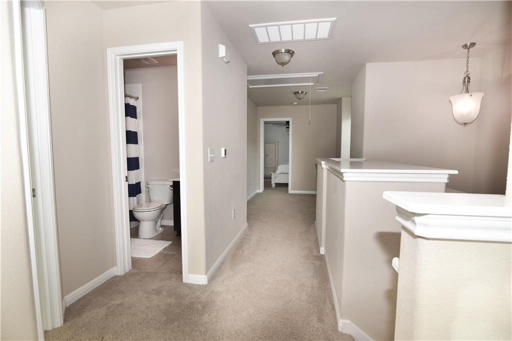 18405 Congaree Street Pflugerville, TX 78660 - Photo 16 of 26 a view of a bathroom with a washer and dryer