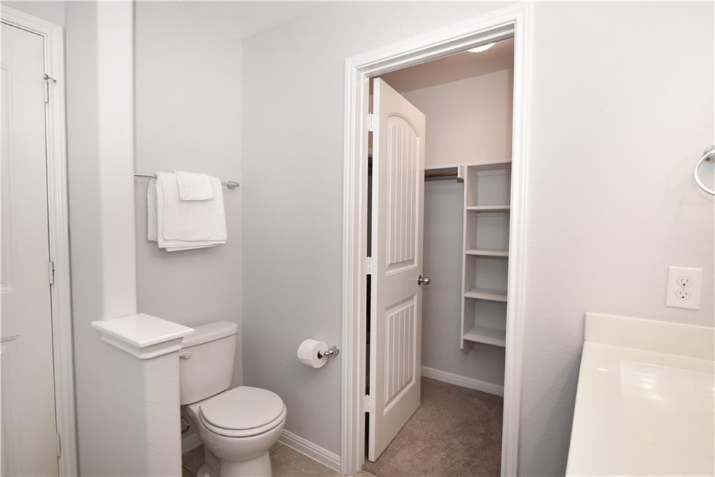 18405 Congaree Street Pflugerville, TX 78660 - Photo 21 of 26 a bathroom with a toilet sink