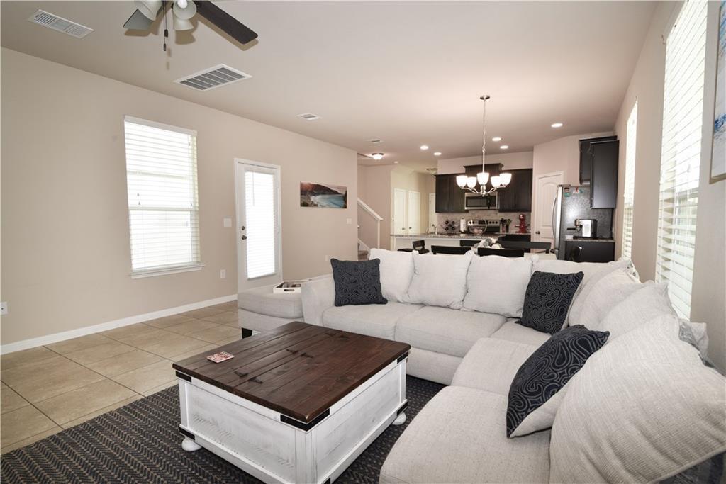 18405 Congaree Street Pflugerville, TX 78660 - Photo 4 of 26 a living room with furniture and a large window