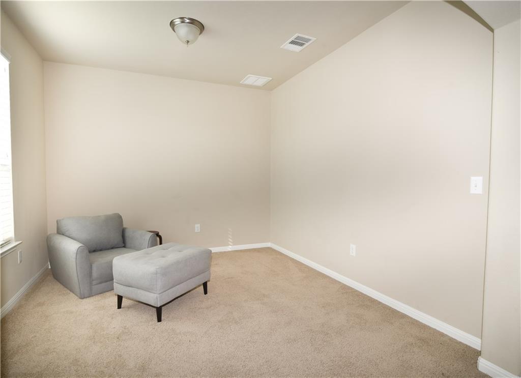 18405 Congaree Street Pflugerville, TX 78660 - Photo 9 of 26 a living room with furniture and a ceiling fan