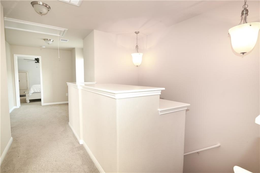 18405 Congaree Street Pflugerville, TX 78660 - Photo 10 of 26 a view of a room with wooden floor