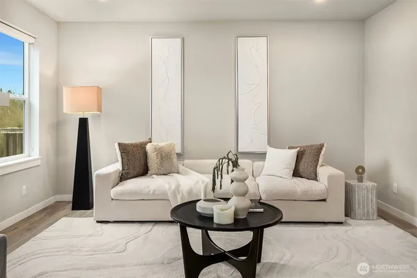 a living room with furniture and a lamp