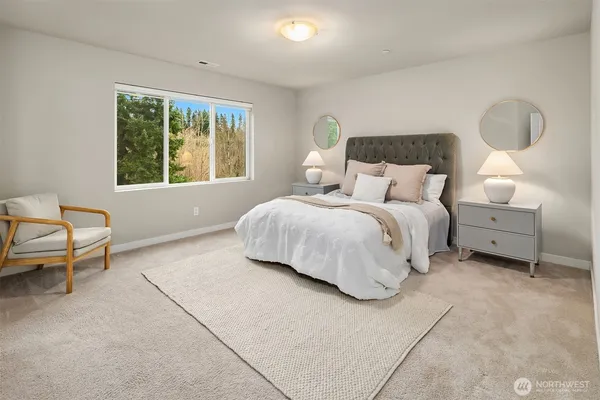 a bedroom with a bed and a lamp