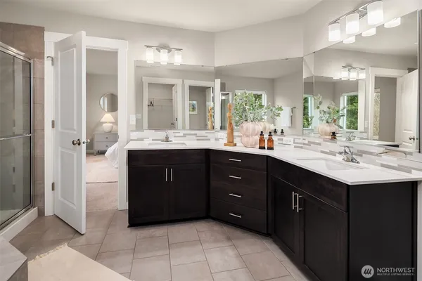 a bathroom with a sink vanity and a mirror