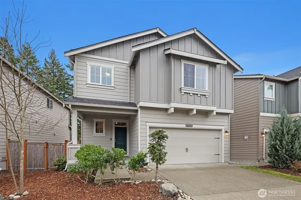 a front view of a house with a garage