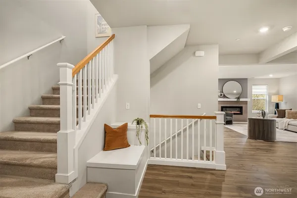 a view of entryway and hall with wooden floor