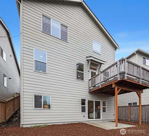 a front view of a house with a car parked