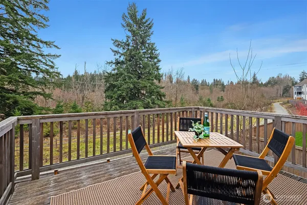 a view of a two chairs in the balcony