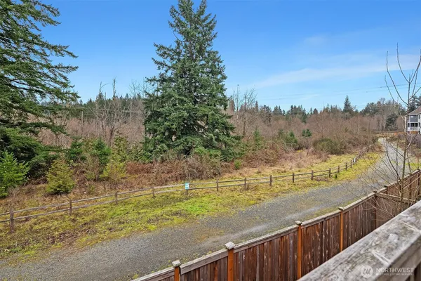 a view of a pathway both side of yard next to a yard