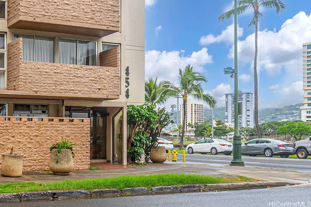 a view of a house with a fountain and a table and chairs