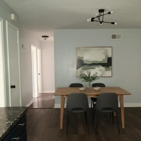 a view of a dining room with furniture