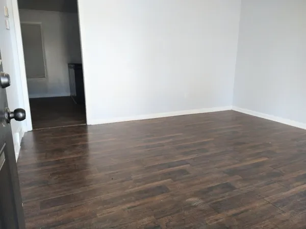 a view of a small space with wooden floor