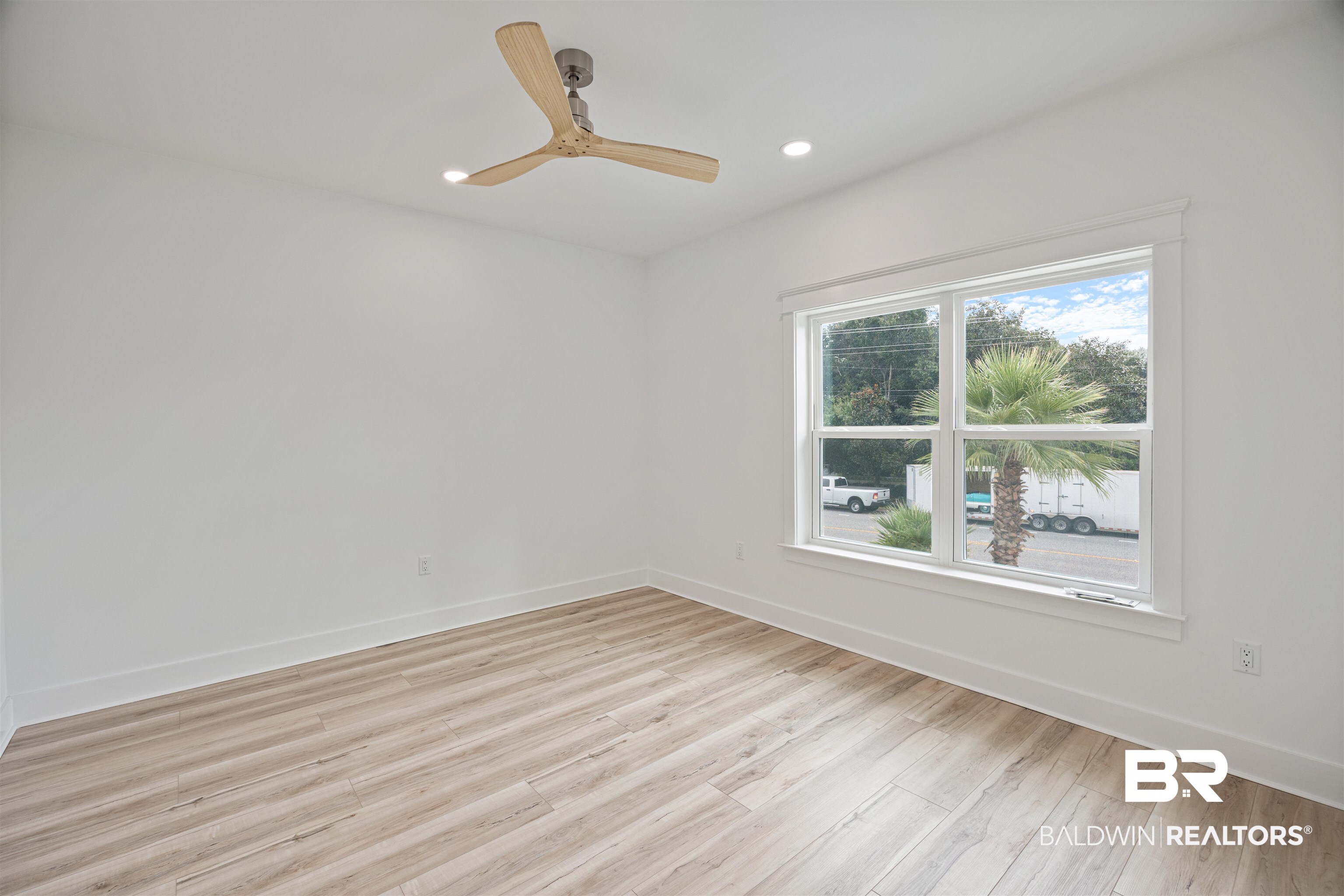 27591 Canal Road Orange Beach, AL 36561 - Photo 43 of 51 Spare room with light wood-type flooring, recessed lighting, and a ceiling fan