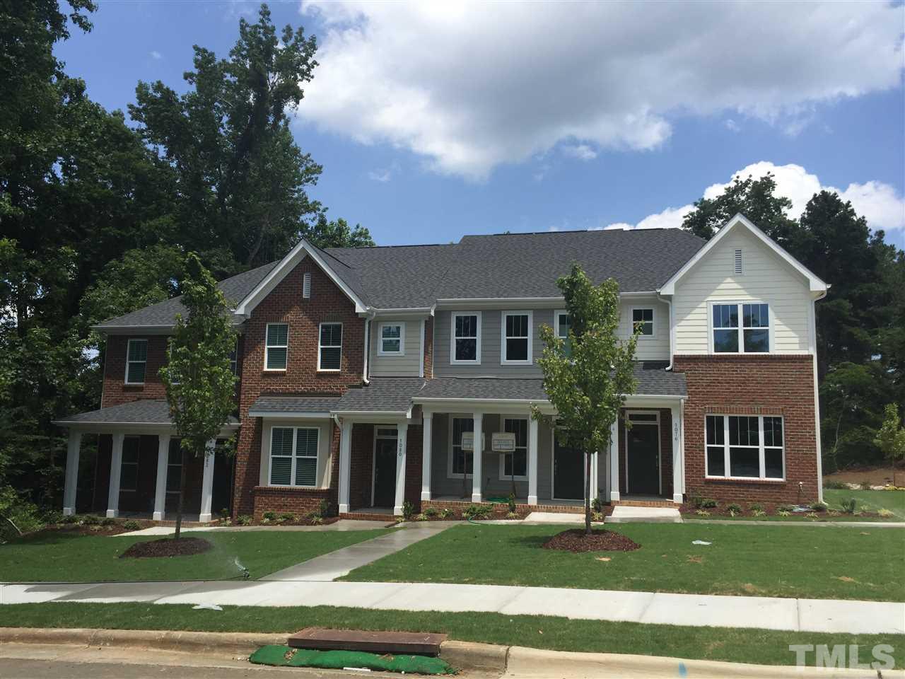 1076 Mills Street Raleigh, NC 27608 - Photo 1 of 16 a front view of a building with a yard