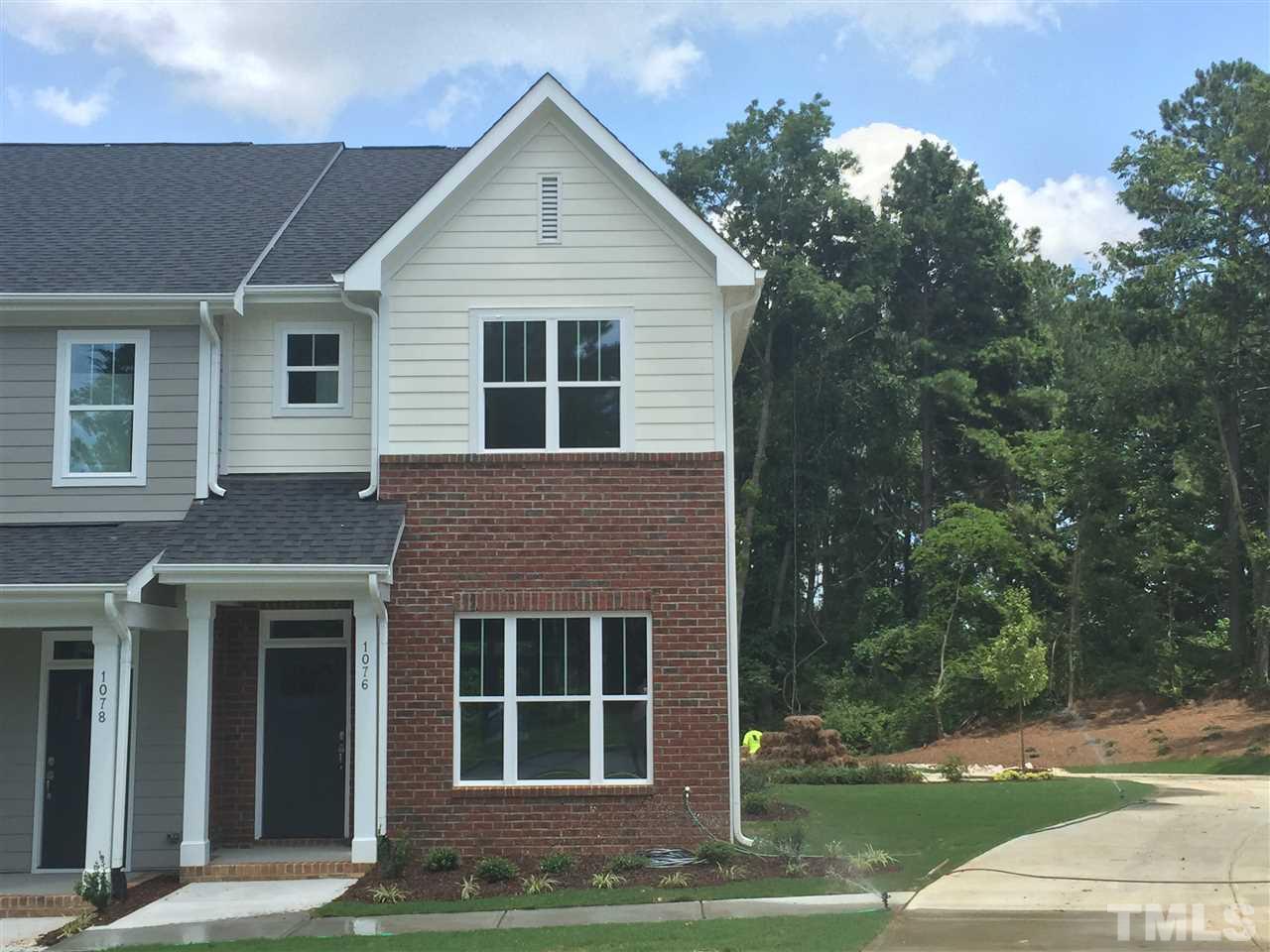 1076 Mills Street Raleigh, NC 27608 - Photo 2 of 16 a view of a house with a yard