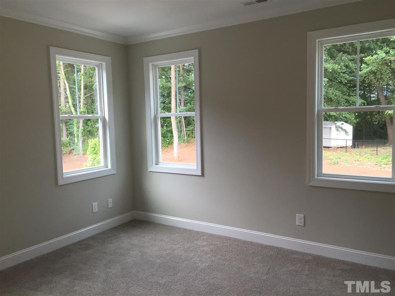 1076 Mills Street Raleigh, NC 27608 - Photo 11 of 16 an empty room with a window