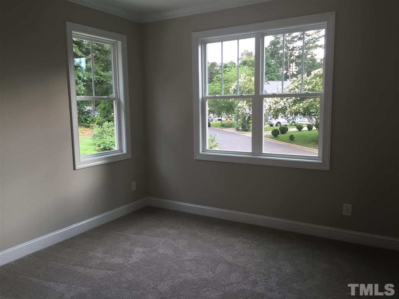 1076 Mills Street Raleigh, NC 27608 - Photo 14 of 16 an empty room with a window