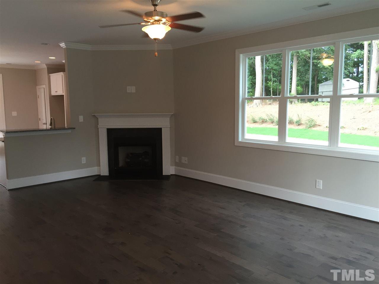 1076 Mills Street Raleigh, NC 27608 - Photo 5 of 16 a view of an empty room with a window