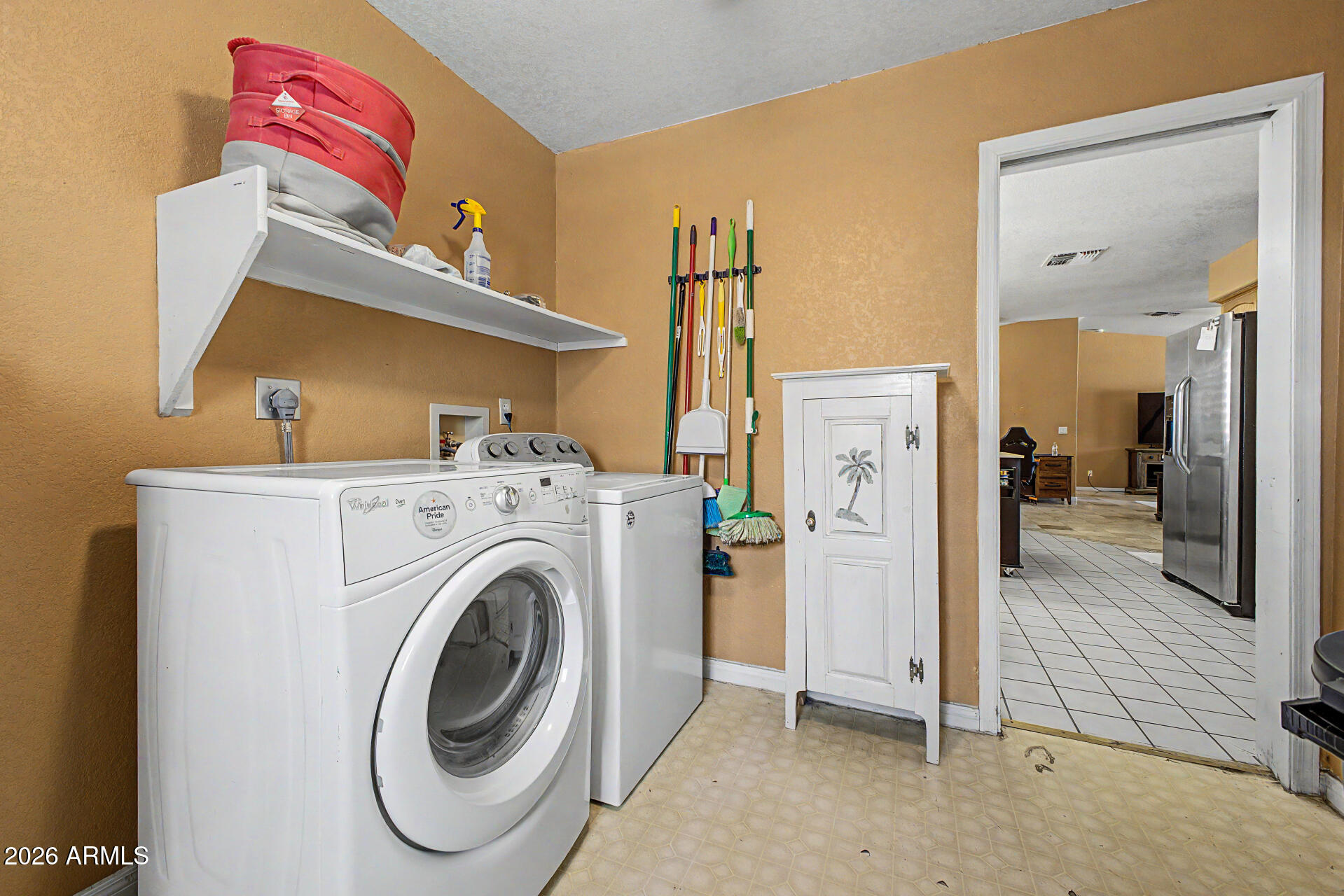 660 South Stardust Lane Apache Junction, AZ 85120 - Photo 12 of 15 a view of a hallway with washer and dryer