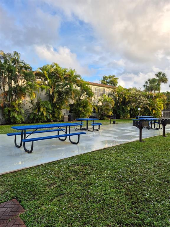 560 Southeast 2nd Avenue, Unit H2 Deerfield Beach, FL 33441 - Photo 22 of 23 a park view with a bench