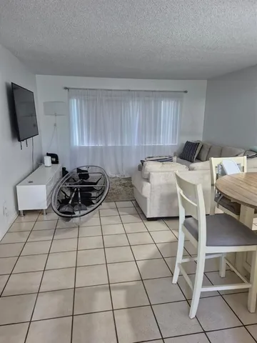 a bed room with a bed and a chair