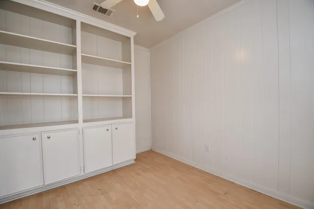 a view of an empty walk in closet