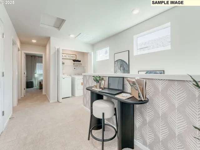 a view of a kitchen with furniture and wooden floor