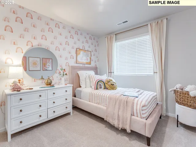 a bedroom with a bed and a dresser