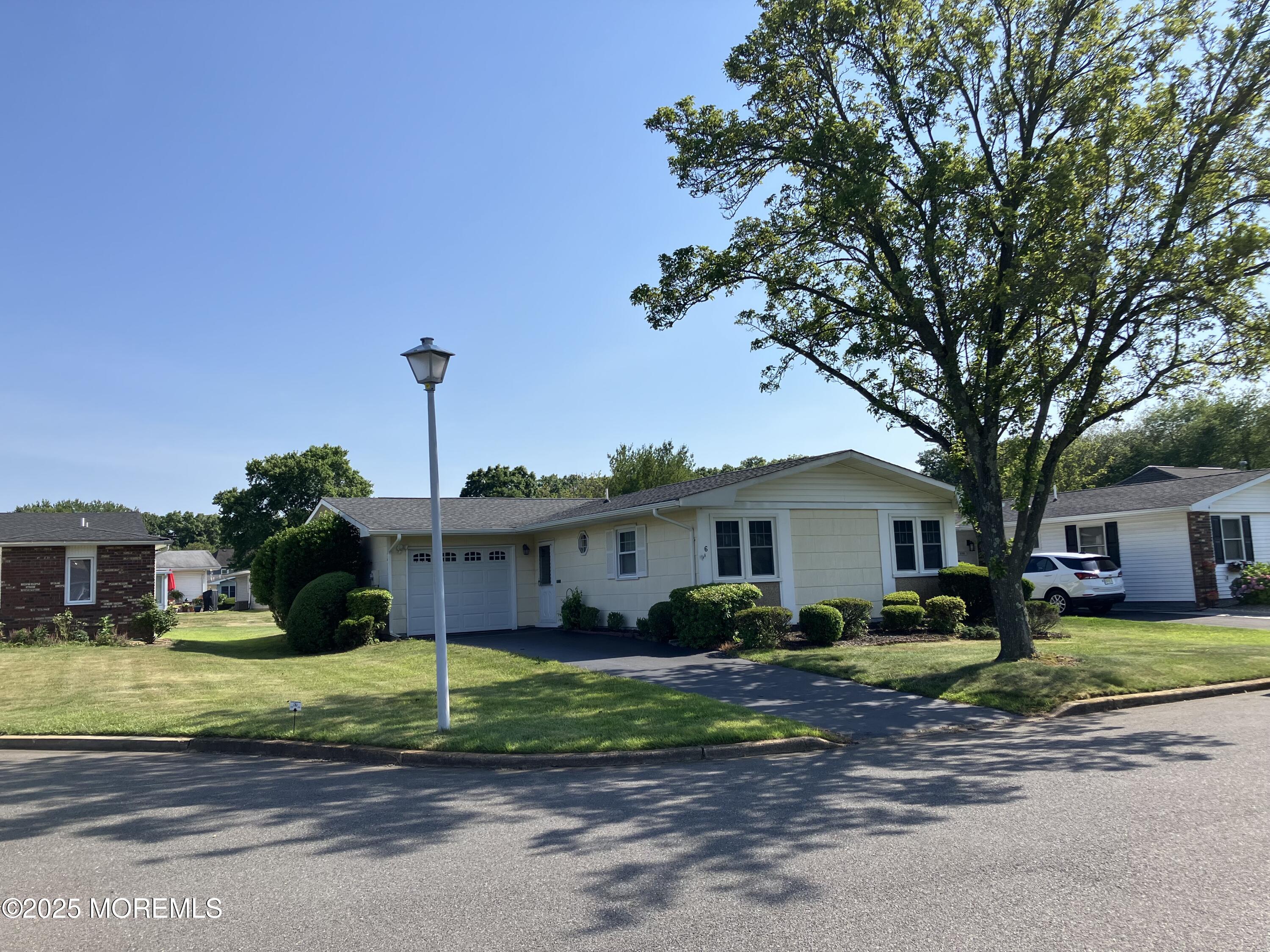 Undisclosed Address Brick, NJ 08724 - Photo 2 of 13 a front view of a house with a yard
