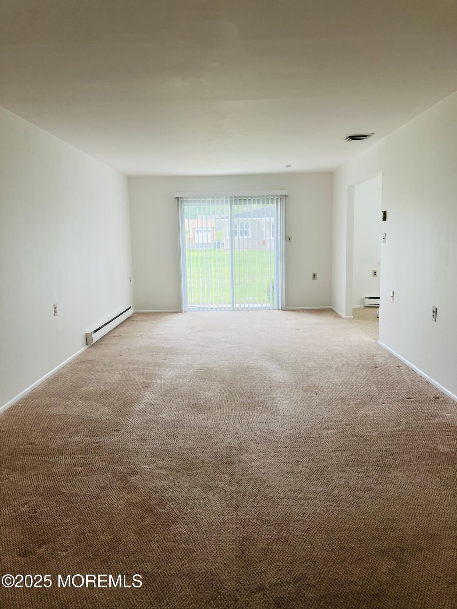 Undisclosed Address Brick, NJ 08724 - Photo 4 of 13 a view of an empty room with a window